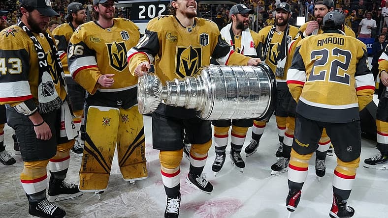 Jun 13, 2023; Las Vegas, Nevada, USA; Vegas Golden Knights forward Brett Howden (21) hoists the Stanley Cup after defeating the Florida Panthers in game five of the 2023 Stanley Cup Final at T-Mobile Arena. Mandatory Credit: Stephen R. Sylvanie-USA TODAY Sports