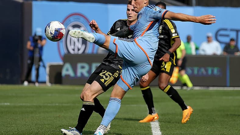 Jun 17, 2023; New York, New York, USA; New York City FC defender Braian Cufre (3) takes a shot against Columbus Crew SC midfielder Sean Zawadzki (25) during the second half at Yankee Stadium. Mandatory Credit: Brad Penner-USA TODAY Sports