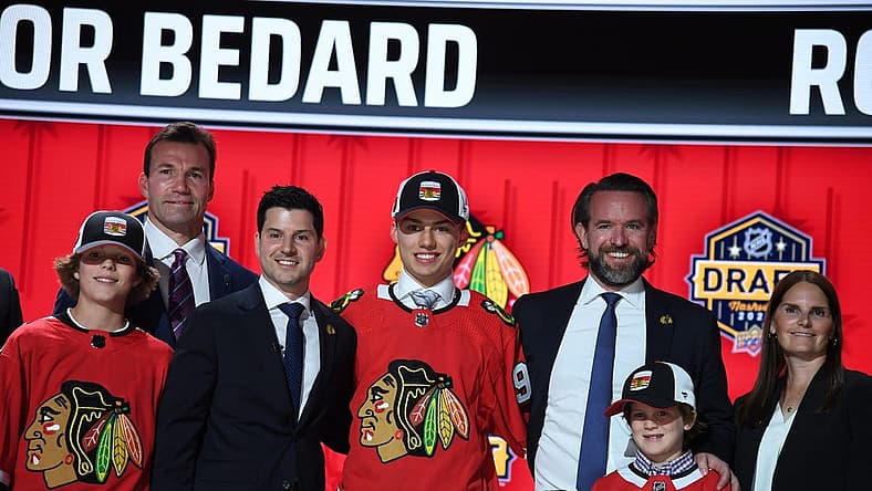 Jun 28, 2023; Nashville, Tennessee, USA; Chicago Blackhawks general manager Kyle Davidson congratulates first overall pick Connor Bedard during the 2023 NHL Draft at Bridgestone Arena. Mandatory Credit: Christopher Hanewinckel-USA TODAY Sports