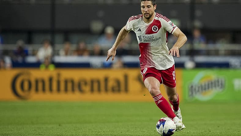 Jul 1, 2023; Cincinnati, Ohio, USA; New England Revolution midfielder Matt Polster (8) dribbles the ball against FC Cincinnati in the second half at TQL Stadium. Mandatory Credit: Aaron Doster-USA TODAY Sports