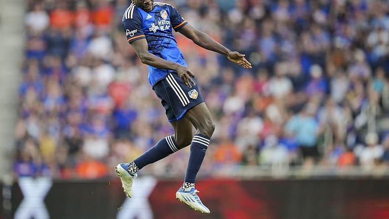 Jun 21, 2023; Cincinnati, Ohio, USA;  FC Cincinnati forward Dominique Badji (14) heads the ball against Toronto FC in the first half at TQL Stadium. Mandatory Credit: Aaron Doster-USA TODAY Sports