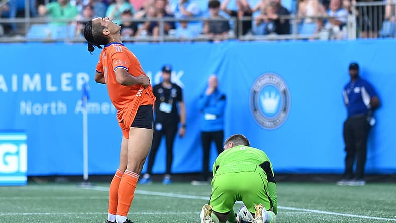 Jul 8, 2023; Charlotte, North Carolina, USA; FC Cincinnati attacker Yugo Kubo (7) reacts as Charlotte FC goalkeeper Kristijan Kahlina (1) saves a goal attempt in the first half at Bank of America Stadium. Mandatory Credit: Griffin Zetterberg-USA TODAY Sportsfc