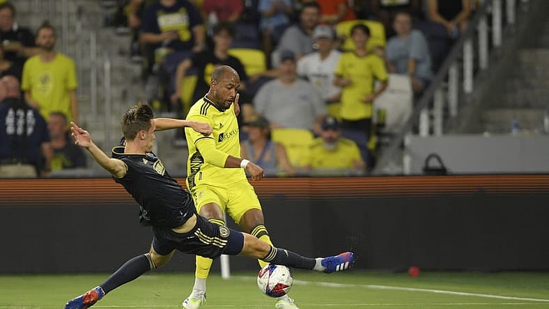 Jul 12, 2023; Nashville, Tennessee, USA;  Philadelphia Union defender Jack Elliott (3) blocks a shot from Nashville SC forward Teal Bunbury (12) in the second half at Geodis Park. Mandatory Credit: Steve Roberts-USA TODAY Sports
