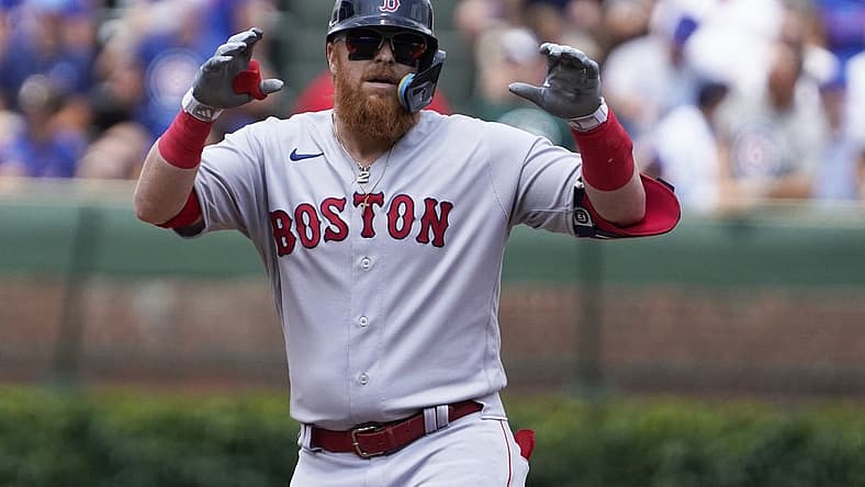 Jul 15, 2023; Chicago, Illinois, USA; Boston Red Sox designated hitter Justin Turner (2) gestures after hitting a double against the Chicago Cubs during the first inning at Wrigley Field. Mandatory Credit: David Banks-USA TODAY Sports