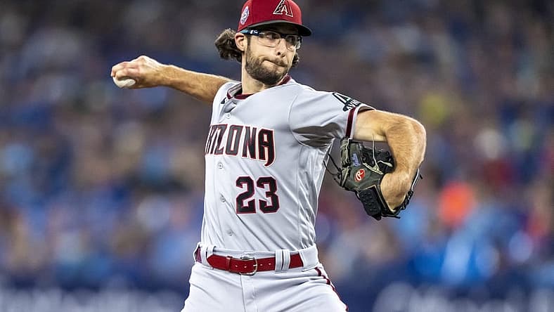 Jul 15, 2023; Toronto, Ontario, CAN; Arizona Diamondbacks starting pitcher Zac Gallen (23) pitches to the Toronto Blue Jays during the first inning at Rogers Centre. Mandatory Credit: Kevin Sousa-USA TODAY Sports