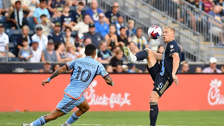 Jul 15, 2023; Philadelphia, Pennsylvania, USA; Philadelphia Union defender Jakob Glesnes (5) controls the ball while defended by New York City FC midfielder Santiago Rodriguez (10) during the first half at Subaru Park. Mandatory Credit: Eric Hartline-USA TODAY Sports