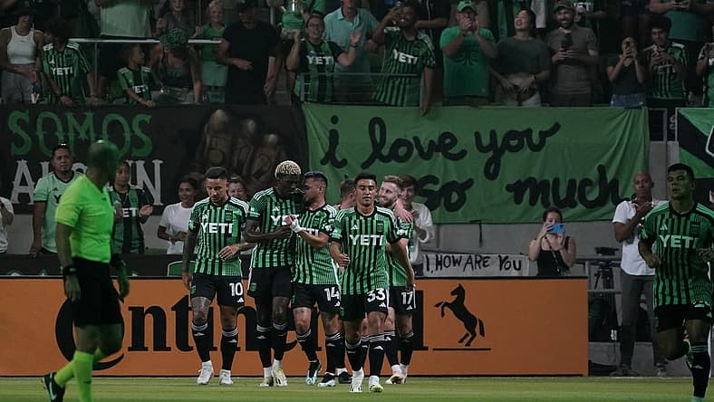 Jul 15, 2023; Austin, Texas, USA; Austin FC midfielder Ethan Finlay (13) celebrates with teammates after scoring a goal against the Sporting Kansas City during the first half at Q2 Stadium. Mandatory Credit: Scott Wachter-USA TODAY Sports