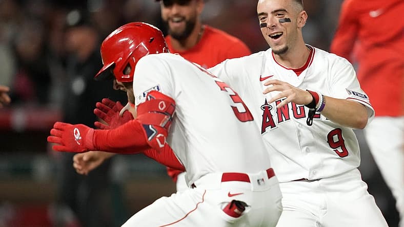 Jul 15, 2023; Anaheim, California, USA; Los Angeles Angels left fielder Taylor Ward (3) celebrates with shortstop Zach Neto (9) after hitting a fielder choice ground ball in the 10th inning to drive in the winning run against the Houston Astros at Angel Stadium. Mandatory Credit: Kirby Lee-USA TODAY Sports
