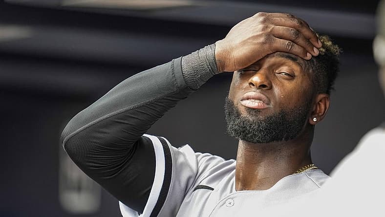 Jul 16, 2023; Cumberland, Georgia, USA; Chicago White Sox center fielder Luis Robert Jr. (88) reacts while standing under the air conditioner vent in the dugout against the Atlanta Braves during the seventh inning at Truist Park. Mandatory Credit: Dale Zanine-USA TODAY Sports