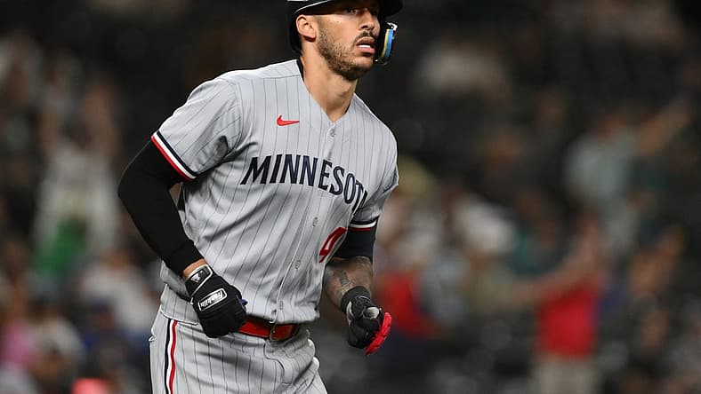 Jul 18, 2023; Seattle, Washington, USA; Minnesota Twins shortstop Carlos Correa (4) runs toward first base after hitting a home run against the Seattle Mariners during the ninth inning at T-Mobile Park. Mandatory Credit: Steven Bisig-USA TODAY Sports