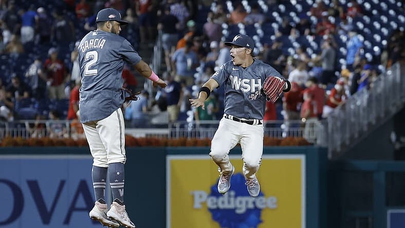 Jul 22, 2023; Washington, District of Columbia, USA; Washington Nationals second baseman Luis Garcia (2) celebrates with Nationals center fielder Alex Call (17) after their game against the San Francisco Giants at Nationals Park. Mandatory Credit: Geoff Burke-USA TODAY Sports