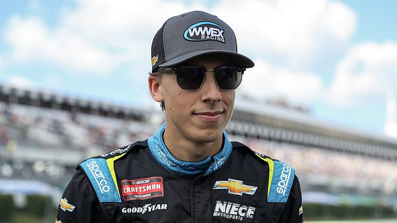 Jul 22, 2023; Long Pond, Pennsylvania, USA; NASCAR Craftsman Truck Series driver Carson Hocevar stands on pit road prior to the CRC Brakleen 150 at Pocono Raceway. Mandatory Credit: Matthew O'Haren-USA TODAY Sports