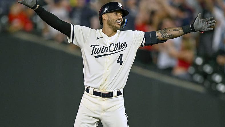 Jul 24, 2023; Minneapolis, Minnesota, USA; Minnesota Twins infielder Carlos Correa (4) celebrates his walk-off RBI single against the Seattle Mariners during the tenth inning at Target Field. Mandatory Credit: Nick Wosika-USA TODAY Sports