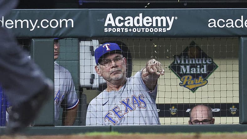 Jul 25, 2023; Houston, Texas, USA; Texas Rangers manager Bruce Bochy (15) throws seeds in the dugout after the results of a video review during the eighth inning against the Houston Astros at Minute Maid Park. Mandatory Credit: Troy Taormina-USA TODAY Sports