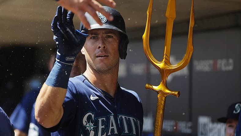 Jul 26, 2023; Minneapolis, Minnesota, USA; Seattle Mariners shortstop Dylan Moore (25) celebrates his solo home run with teammates in the dugout against the Minnesota Twins in the second inning at Target Field. Mandatory Credit: Bruce Kluckhohn-USA TODAY Sports