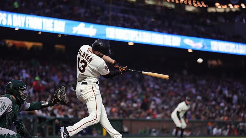 Jul 26, 2023; San Francisco, California, USA; San Francisco Giants left fielder Austin Slater (13) hits a two-run home run during the sixth inning against the Oakland Athletics at Oracle Park. Mandatory Credit: Sergio Estrada-USA TODAY Sports