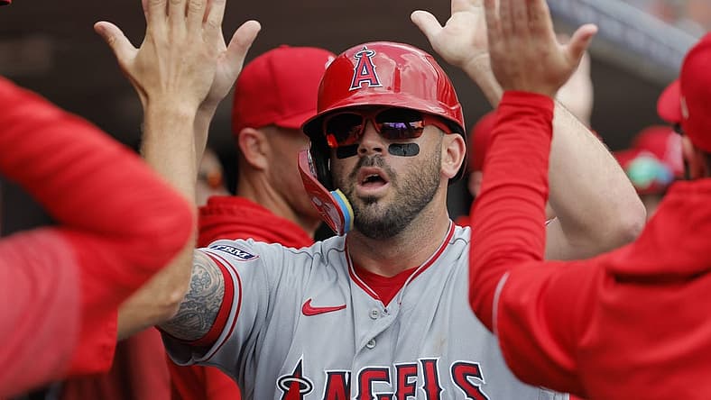 Jul 27, 2023; Detroit, Michigan, USA; Los Angeles Angels third baseman Mike Moustakas (8) receives congratulations from teammates after scoring in the second inning against the Detroit Tigers at Comerica Park. Mandatory Credit: Rick Osentoski-USA TODAY Sports