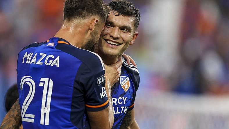 Jul 27, 2023; Cincinnati, OH, USA; FC Cincinnati forward Brandon Vazquez (19) reacts after scoring a goal with defender Matt Miazga (21) in the first half after the game at TQL Stadium. Mandatory Credit: Katie Stratman-USA TODAY Sports
