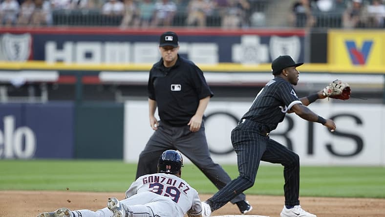 Jul 28, 2023; Chicago, Illinois, USA; Cleveland Guardians right fielder Oscar Gonzalez (39) steals second base against Chicago White Sox shortstop Tim Anderson (7) during the fifth inning at Guaranteed Rate Field. Mandatory Credit: Kamil Krzaczynski-USA TODAY Sports