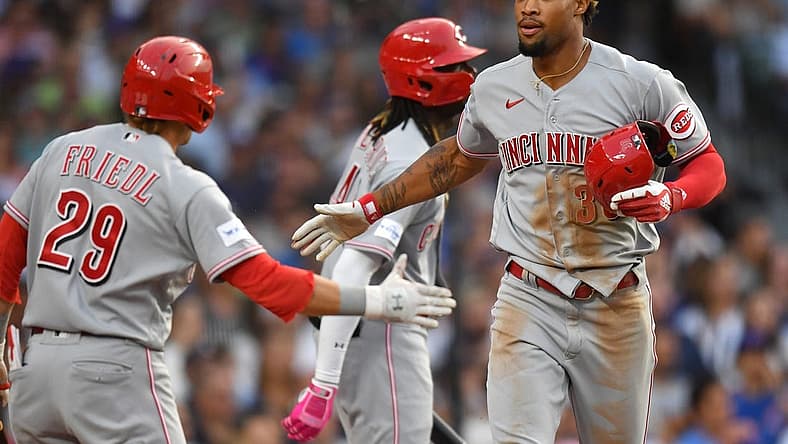 Jul 31, 2023; Chicago, Illinois, USA; Cincinnati Reds left fielder Will Benson (30) celebrates after scoring during the second inning against the Chicago Cubs at Wrigley Field. Mandatory Credit: Patrick Gorski-USA TODAY Sports