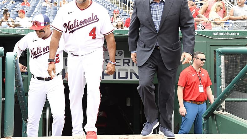Jul 17, 2022; Washington, District of Columbia, USA;  Washington Nationals manager Dave Martinez (4) and general manager Mike Rizzo (right) step onto the field for a pre-game ceremony at Nationals Park. Mandatory Credit: James A. Pittman-USA TODAY Sports