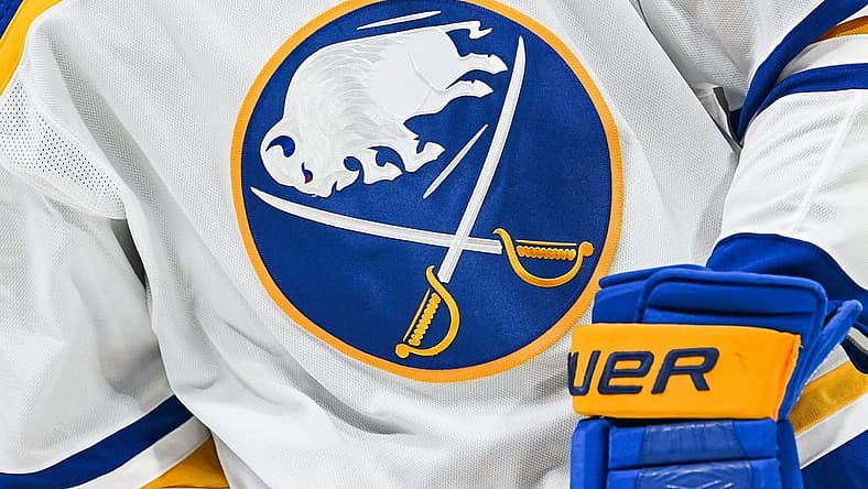 Nov 22, 2022; Montreal, Quebec, CAN; View of a Buffalo Sabres logo on a jersey worn by a member of the team during warm-up before the game against the Montreal Canadiens at Bell Centre. Mandatory Credit: David Kirouac-USA TODAY Sports