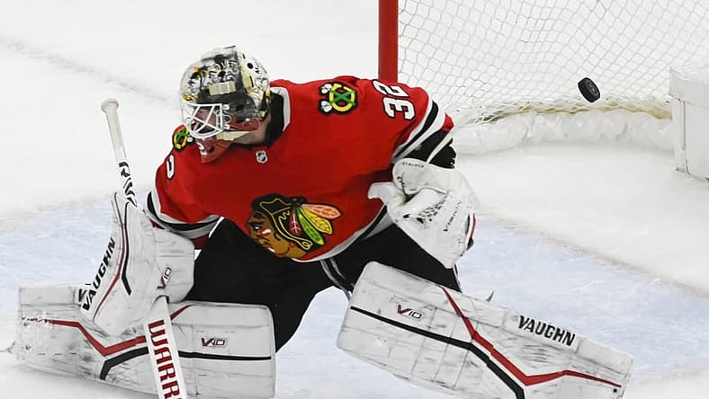 Apr 10, 2023; Chicago, Illinois, USA; Chicago Blackhawks goaltender Alex Stalock (32) cannot stop a goal by Minnesota Wild left wing Marcus Johansson (90) during the third period at the United Center. Mandatory Credit: Matt Marton-USA TODAY Sports