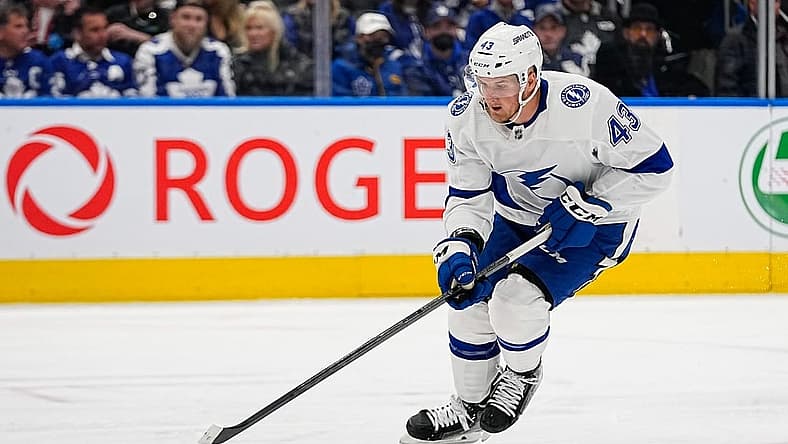 Apr 18, 2023; Toronto, Ontario, CAN; Tampa Bay Lightning defenseman Darren Raddysh (43) tries to control a puck during game one of the first round of the 2023 Stanley Cup Playoffs at Scotiabank Arena. Mandatory Credit: John E. Sokolowski-USA TODAY Sports