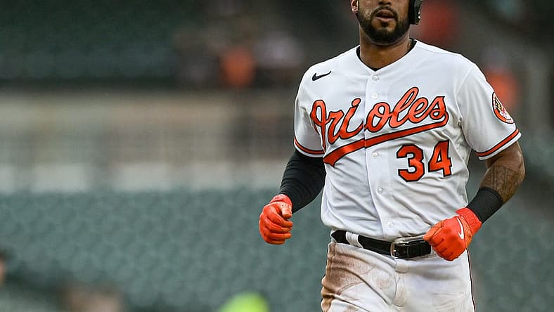 Jun 27, 2023; Baltimore, Maryland, USA; Baltimore Orioles left fielder Aaron Hicks (34) scores on right fielder Ryan McKenna (not pictured) second inning sacrifice fly Cincinnati Reds at Oriole Park at Camden Yards. Mandatory Credit: Tommy Gilligan-USA TODAY Sports