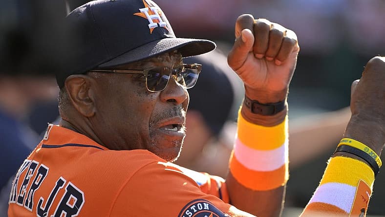 Jul 16, 2023; Anaheim, California, USA;  Houston Astros manager Dusty Baker Jr. (12) gives signs from the dugout in the fifth inning against the Los Angeles Angels at Angel Stadium. Mandatory Credit: Jayne Kamin-Oncea-USA TODAY Sports