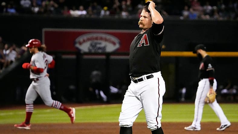 Jul 24, 2023; Phoenix, AZ, USA; Arizona Diamondbacks relief pitcher Andrew Chafin (57) reacts after walking in the winning run against the St. Louis Cardinals in the ninth inning at Chase Field. Mandatory Credit: Rob Schumacher-Arizona Republic