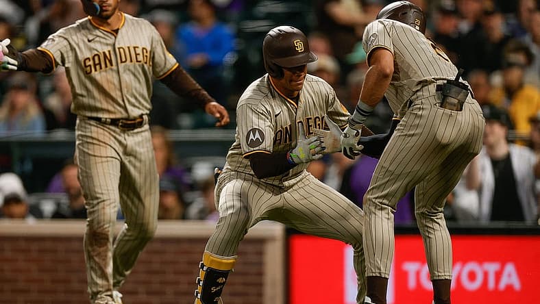 Aug 1, 2023; Denver, Colorado, USA; San Diego Padres left fielder Juan Soto (22) celebrates his three run home run with right fielder Fernando Tatis Jr. (23) in the fifth inning against the Colorado Rockies at Coors Field. Mandatory Credit: Isaiah J. Downing-USA TODAY Sports