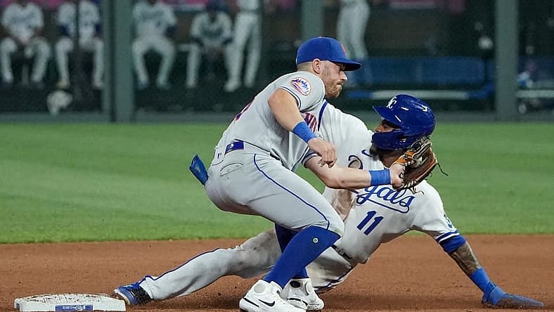 Aug 1, 2023; Kansas City, Missouri, USA; New York Mets second baseman Danny Mendick (15) attempts to make the tag as Kansas City Royals third baseman Maikel Garcia (11) steals second base in the seventh inning at Kauffman Stadium. Mandatory Credit: Denny Medley-USA TODAY Sports