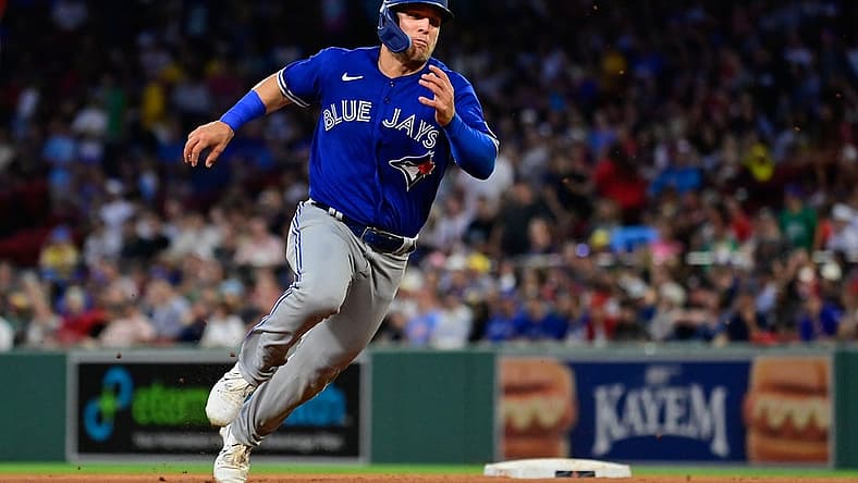 Aug 4, 2023; Boston, Massachusetts, USA; Toronto Blue Jays center fielder Daulton Varsho (25) scores on an RBI by right fielder George Springer (4) during the fourth inning against the Boston Red Sox at Fenway Park. Mandatory Credit: Eric Canha-USA TODAY Sports