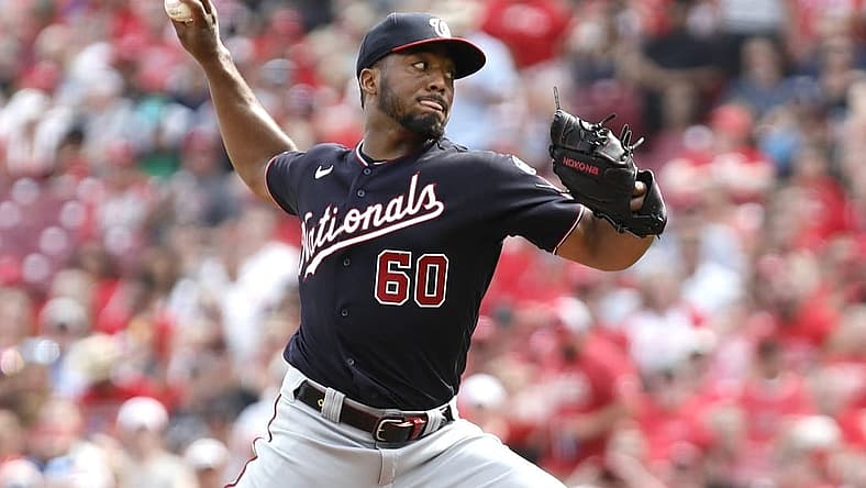 Aug 5, 2023; Cincinnati, Ohio, USA; Washington Nationals Joan Adon (60) throws against the Cincinnati Reds during the second inning at Great American Ball Park. Mandatory Credit: David Kohl-USA TODAY Sports