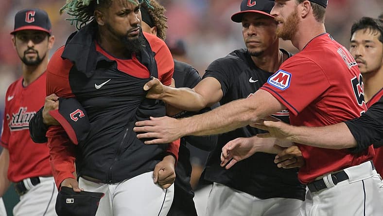 Aug 5, 2023; Cleveland, Ohio, USA; Teammates restrain Cleveland Guardians relief pitcher Emmanuel Clase (48) after a fight during the sixth inning at Progressive Field. Mandatory Credit: Ken Blaze-USA TODAY Sports