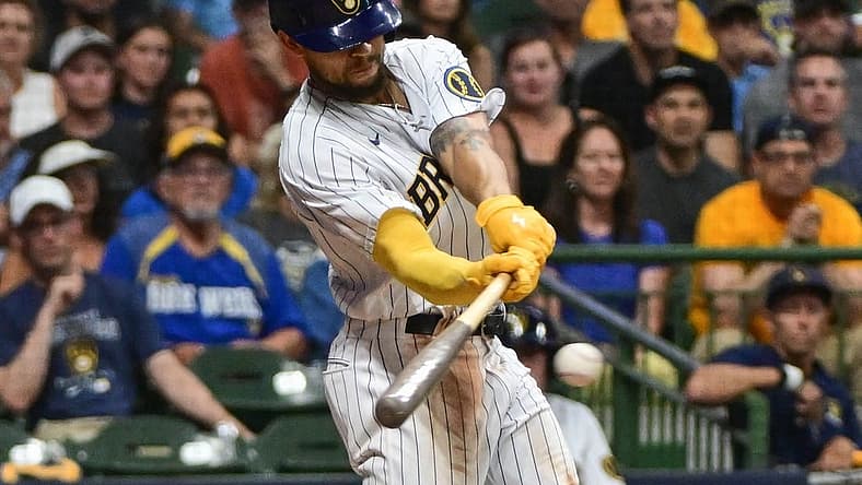 Aug 5, 2023; Milwaukee, Wisconsin, USA;  Milwaukee Brewers right fielder Blake Perkins (16) drives in the winning run with a base hit in the tenth inning against the Pittsburgh Pirates at American Family Field. Mandatory Credit: Benny Sieu-USA TODAY Sports