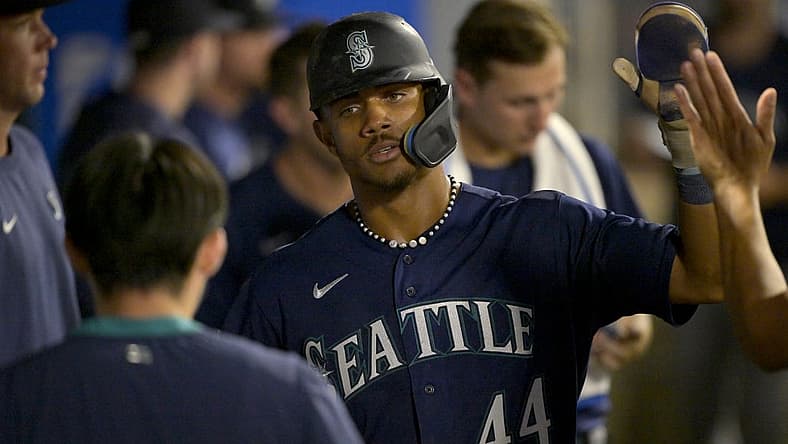 Aug 5, 2023; Anaheim, California, USA;  Seattle Mariners center fielder Julio Rodriguez (44) is congratulated in the dugout after scoring a run in the eighth inning against the Los Angeles Angels at Angel Stadium. Mandatory Credit: Jayne Kamin-Oncea-USA TODAY Sports