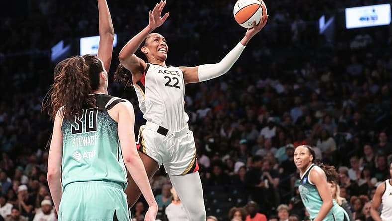 Aug 6, 2023; Brooklyn, New York, USA; Las Vegas Aces forward A'ja Wilson (22) drives to the basket in the third quarter against the New York Liberty at Barclays Center. Mandatory Credit: Wendell Cruz-USA TODAY Sports