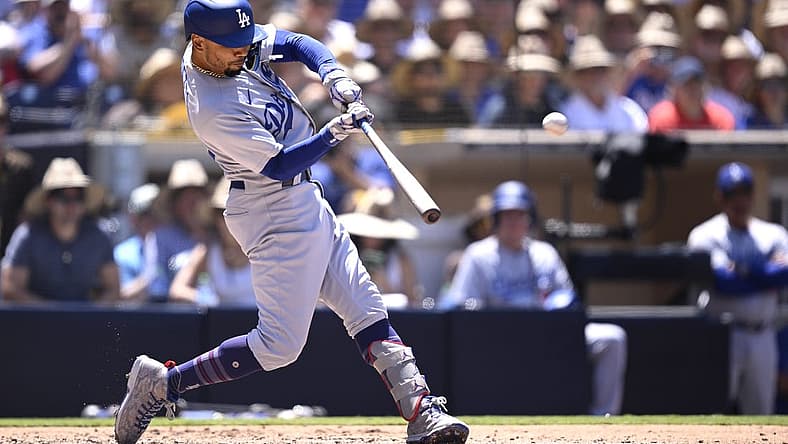 Aug 7, 2023; San Diego, California, USA; Los Angeles Dodgers second baseman Mookie Betts (50) hits a grand slam home run during the fourth inning against the San Diego Padres at Petco Park. Mandatory Credit: Orlando Ramirez-USA TODAY Sports