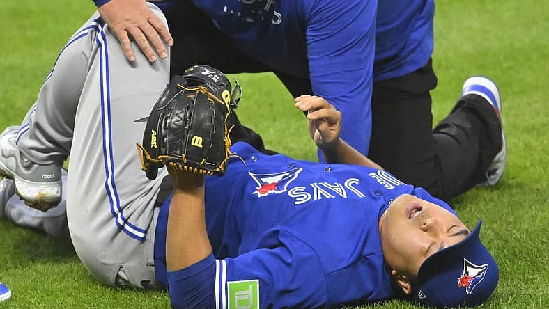 Aug 7, 2023; Cleveland, Ohio, USA; Toronto Blue Jays starting pitcher Hyun Jin Ryu (99) reacts after he was hit by a batted ball in the fourth inning against the Cleveland Guardians at Progressive Field. Mandatory Credit: David Richard-USA TODAY Sports
