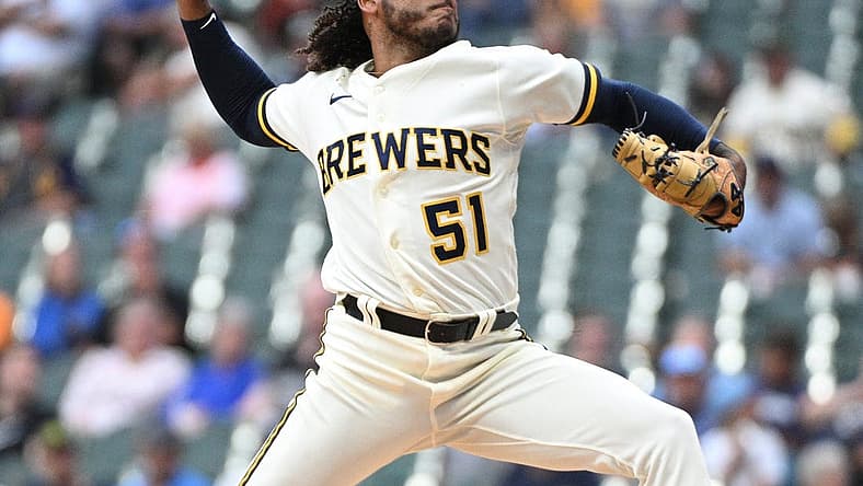 Aug 7, 2023; Milwaukee, Wisconsin, USA; Milwaukee Brewers starting pitcher Freddy Peralta (51) delivers a pitch against the Colorado Rockies in the first inning at American Family Field. Mandatory Credit: Michael McLoone-USA TODAY Sports