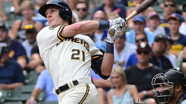 Aug 9, 2023; Milwaukee, Wisconsin, USA;  Milwaukee Brewers first baseman Mark Canha (21) hits a double to drive in a run in the tenth inning against the Colorado Rockies at American Family Field. Mandatory Credit: Benny Sieu-USA TODAY Sports