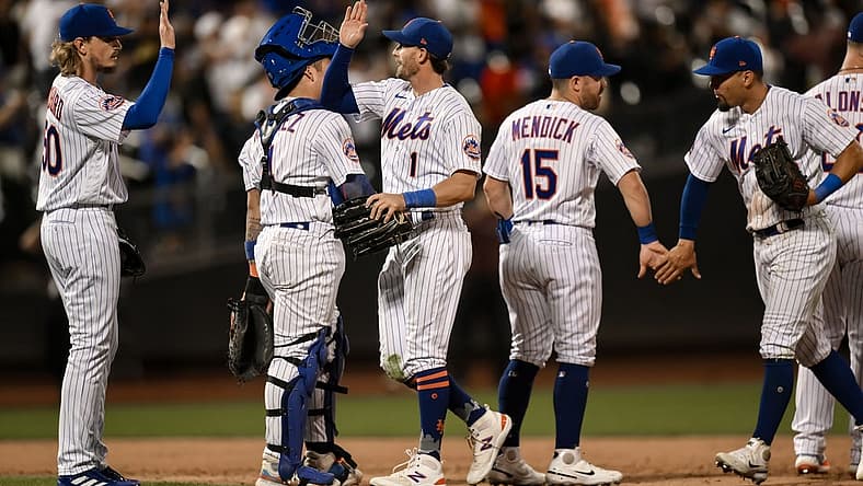 Aug 9, 2023; New York City, New York, USA; New York Mets second baseman Jeff McNeil (1) high fives teammates after defeating the Chicago Cubs at Citi Field. Mandatory Credit: John Jones-USA TODAY Sports