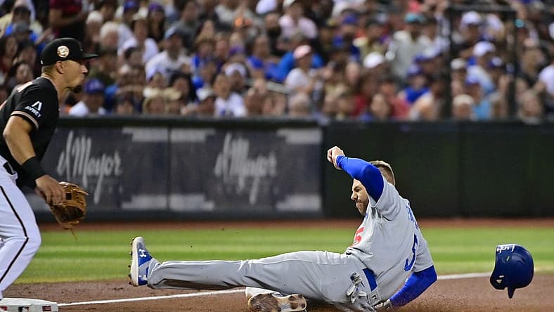 Aug 9, 2023; Phoenix, Arizona, USA;  Los Angeles Dodgers first baseman Freddie Freeman (5) slides into third base in the fourth inning at Chase Field. Mandatory Credit: Matt Kartozian-USA TODAY Sports