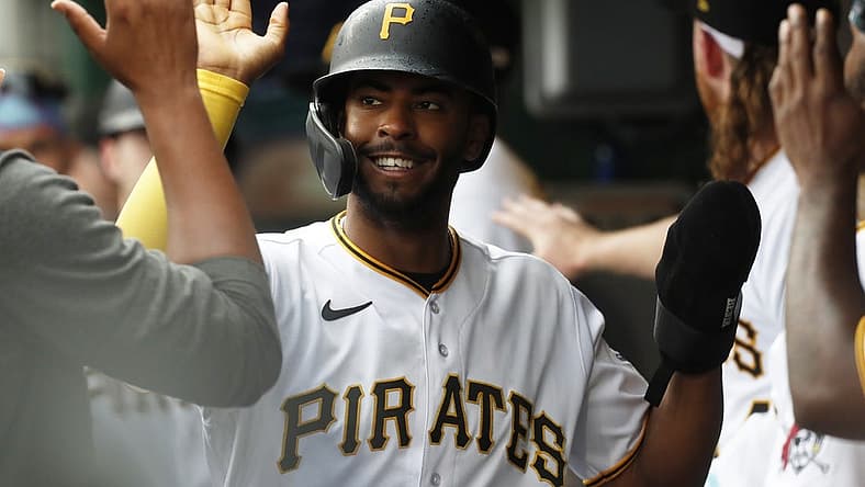 Aug 10, 2023; Pittsburgh, Pennsylvania, USA; Pittsburgh Pirates left fielder Josh Palacios (54) high-fives in the dugout after scoring a run against the Atlanta Braves during the third inning at PNC Park. Mandatory Credit: Charles LeClaire-USA TODAY Sports