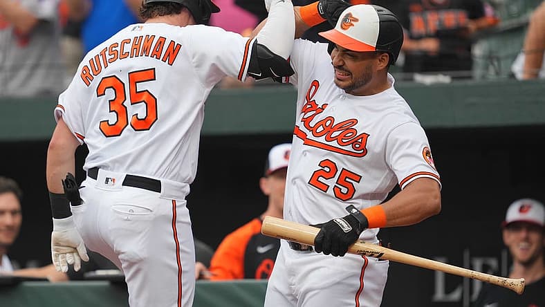 Aug 10, 2023; Baltimore, Maryland, USA; Baltimore Orioles designated hitter Adley Rutschman (35) is greeted by outfielder Anthony Santander (25) following his solo home run in the first inning against the Houston Astros at Oriole Park at Camden Yards. Mandatory Credit: Mitch Stringer-USA TODAY Sports