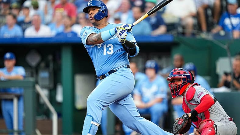Aug 11, 2023; Kansas City, Missouri, USA; Kansas City Royals catcher Salvador Perez (13) hits an RBI double against the St. Louis Cardinals during the first inning at Kauffman Stadium. Mandatory Credit: Jay Biggerstaff-USA TODAY Sports