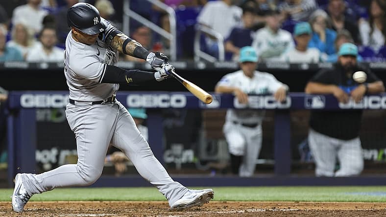 Aug 11, 2023; Miami, Florida, USA; New York Yankees second baseman Gleyber Torres (25) hits a double against the Miami Marlins during the sixth inning at loanDepot Park. Mandatory Credit: Sam Navarro-USA TODAY Sports