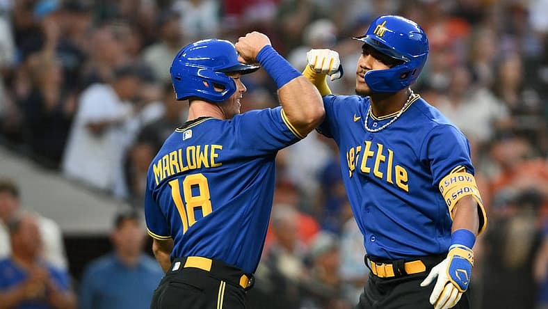 Aug 11, 2023; Seattle, Washington, USA; Seattle Mariners left fielder Cade Marlowe (18) and center fielder Julio Rodriguez (44) celebrate after Rodriguez hit a 3-run home run against the Baltimore Orioles during the fourth inning at T-Mobile Park. Mandatory Credit: Steven Bisig-USA TODAY Sports